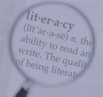 Magnifying glass over the word literacy