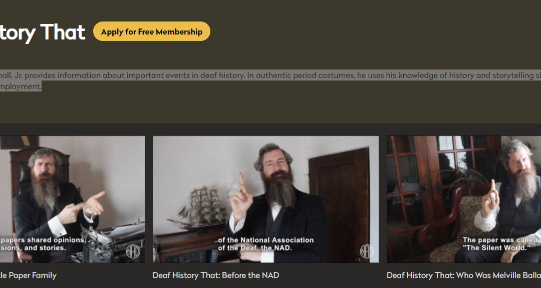 Screen shot of webpage, man with beard signing
