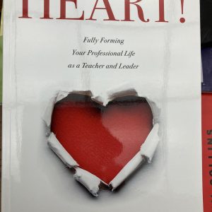 Book cover- white cover with a red heart cut into paper in the middle