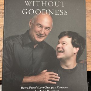 book cover- a father with his hand on his son's shoulder as the son is smiling