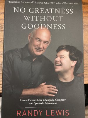 book cover- a father with his hand on his son's shoulder as the son is smiling