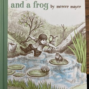 Book cover- Green, blue and brown colors showing a boy trying to catch a frog in a pond