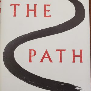 white book cover with red words and a black line