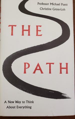 white book cover with red words and a black line