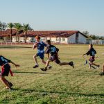 Image of students playing flag football from PDSD and ASDB